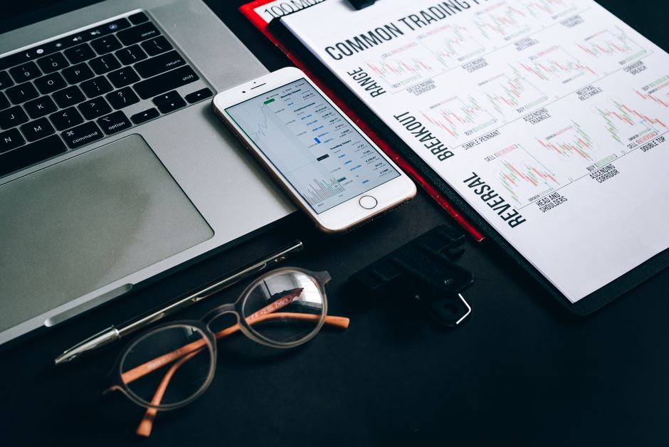 Workstation with laptop, smartphone, eyeglasses